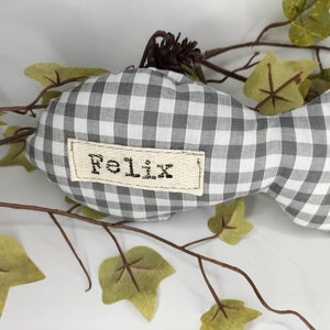 Personalised fish shaped cat toy with bell. Gingham fabric
