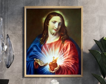 Könnte beinhalten: Ein Gemälde von Jesus Christus mit einem leuchtenden Herzen und einem Kreuz. Das Herz ist rot und das Kreuz ist golden. Das Gemälde ist in einem Holzrahmen gerahmt.