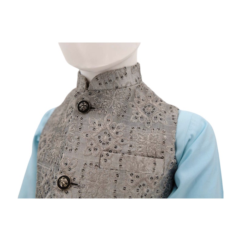 May include: A gray waistcoat with a floral pattern and silver buttons. The waistcoat has a mandarin collar and a pocket on the front.
