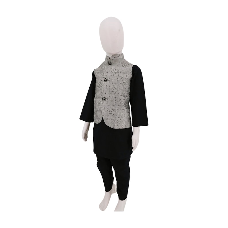 May include: A black kurta and matching pants with a silver patterned waistcoat. The waistcoat has a mandarin collar and a button closure.