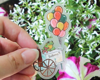Balloon Cart Frog Clear Vinyl Sticker | 1.85 x 3 inches | Transparent, Durable, Waterproof Funny, Colorful Carnival Vendor Animal Decal