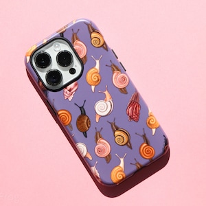 May include: A purple phone case with a pattern of snails in various colors and designs. The case has a camera lens cutout and a raised lip around the edges.