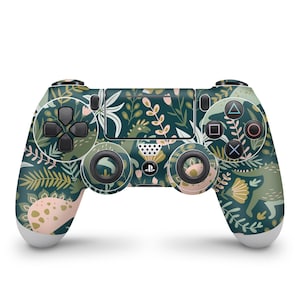 May include: A green, white, and pink patterned Playstation 4 controller with a floral and dinosaur design.