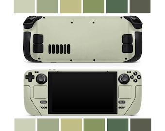 Peut inclure: Un appareil de jeu portable de couleur grise et noire. L'appareil possède un grand écran, deux joysticks et une variété de boutons. L'appareil est présenté de face et de dos.