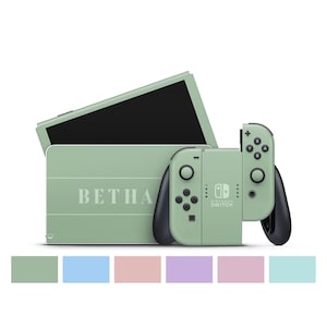 May include: A mint green Nintendo Switch console with matching Joy-Con controllers. The console has the word "BETH" printed on it. The controllers have black buttons and joysticks. A color palette of pastel colors is at the bottom.