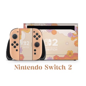 May include: A Nintendo Switch 2 gaming console with a retro floral design in peach, orange, and purple. The console and controllers feature the text "Nintendo Switch 2". The design includes stylized flowers and wavy patterns.