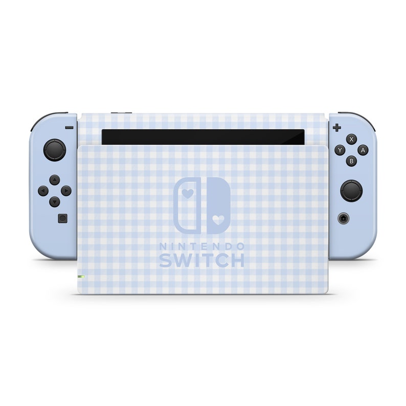 May include: A light blue Nintendo Switch console with a white and light blue gingham pattern. The console has a white Nintendo Switch logo with two hearts.