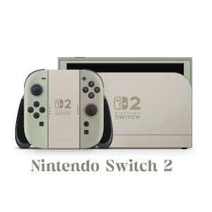 以下が含まれることがあります： ベージュ色のNintendo Switch 2コンソールと、それに合わせたコントローラー。コントローラーは黒いアクセントと緑色のボタンが付いています。コンソールとコントローラーにはNintendo Switchのロゴがあります。「Nintendo Switch 2」の文字が下にあります。