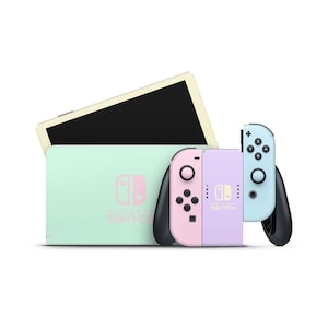Può includere: Una console Nintendo Switch di colore verde pastello e viola con un controller Joy-Con rosa e blu abbinato. La console ha un logo Nintendo Switch bianco sul davanti.