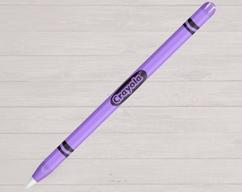 May include: A purple Apple Pencil with a Crayola brand skin. The skin has a black Crayola logo and black stripes on the ends.