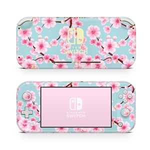 May include: A light blue Nintendo Switch Lite console with a pink and white floral design. The console has a pink screen and the Nintendo Switch logo is visible on the front.