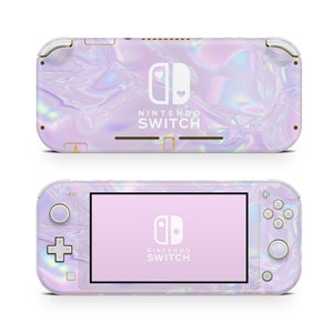 May include: A Nintendo Switch Lite console with a pearlescent, iridescent finish. The device features a light purple and pink colour scheme with the Nintendo Switch logo and text. The screen displays the Nintendo Switch logo.
