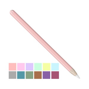 May include: A pink Apple Pencil with a white tip. The pencil is lying on a white background. A row of 12 color swatches are below the pencil, including pink, light blue, green, yellow, gray, teal, brown, purple, and red.