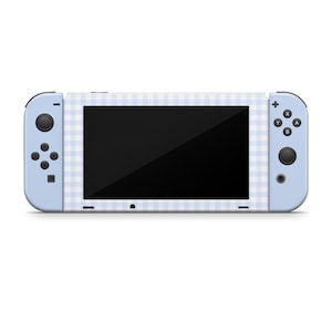 May include: A light blue Nintendo Switch console with a white and light blue gingham pattern.