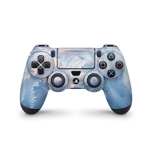 May include: A blue and white PlayStation 4 controller with a swirling pattern. The controller has black buttons and a black PlayStation logo.