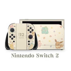 May include: Nintendo Switch 2 console with a cream-colored design featuring cartoon characters and floral accents. The Joy-Con controllers and console have a matching design. The text "Nintendo Switch 2" is displayed below the console.