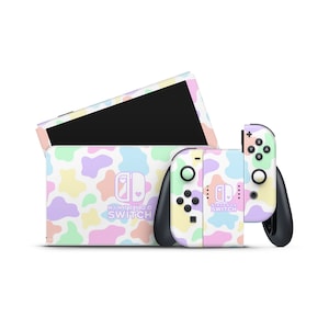 May include: A pastel pink, yellow, blue, and green patterned Nintendo Switch console and controller with the Nintendo Switch logo.