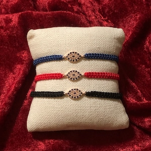 Oval evil eye string bracelet