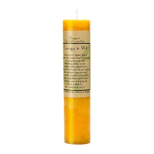 May include: A yellow pillar candle with a green label that reads "Blessed Herbal Candles Energy & Will" and a poem about energy and will.