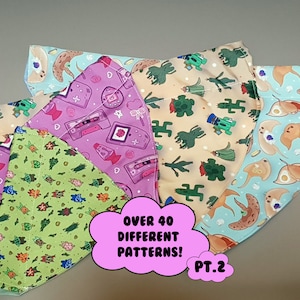 May include: A set of five colorful fabric face masks with different patterns. The masks feature a variety of designs, including plants, animals, and geometric shapes. The text "Over 40 Different Patterns! PT.2" is printed on a pink background.