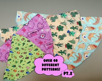May include: A set of five colorful fabric face masks with different patterns. The masks feature a variety of designs, including plants, animals, and geometric shapes. The text "Over 40 Different Patterns! PT.2" is printed on a pink background.