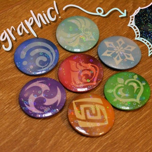 May include: Seven holographic buttons with different designs, including a snowflake, a heart, a swirl, and a maze. The buttons are on a wooden surface. The text "Holographic!" is written in white on a black background.