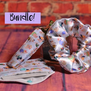Poogie Monster Hunter Bundle - Scrunchie, Porte-clés, Portefeuille Cochon, Iceborne, Rise, World