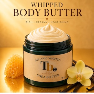 May include: A jar of organic whipped shea butter with the text "Whipped Body Butter". The jar is dark green with a beige label. The whipped butter is light beige and topped with a swirl. A honeycomb and a yellow orchid are next to the jar. The jar contains 16 oz of product.