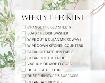 May include: A white checklist with a green plant in the background. The checklist includes tasks such as changing the bed sheets, loading the dishwasher, wiping out the microwave, wiping down kitchen counters, cleaning off the kitchen table, cleaning out the fridge, vacuuming or mopping the floors, dusting light fixtures, dusting furniture and surfaces, cleaning bathrooms, starting, folding, and putting away laundry, taking out the trash and putting in new bags, and cleaning mirrors.