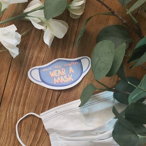 Aime ton prochain, porte un autocollant de masque