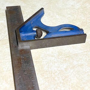 May include: A white ceramic mug with a black handle and the text "But First, Coffee" in a bold, black font. The mug is set against a neutral background, highlighting its simple design.