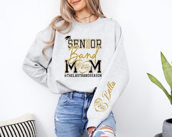Senior 2025 Band Mom Sweatshirt Custom Name Sleeve, Marching Band Mom Shirt, #TheLastBandSeason Senior Mom Gift, Graduation Band Parent