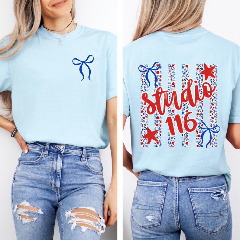 May include: A light blue t-shirt featuring a small blue bow graphic on the front left chest. The back displays a large design with vertical stripes, floral patterns, red stars, blue bows, and the red cursive text "studio 116" centered on the back.