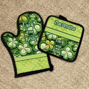 May include: A green and gold oven mitt and pot holder set with a shamrock pattern and the text "Luck of the Irish". The pot holder also has the text "The Smiths".