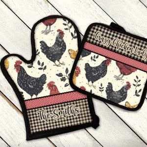 May include: A set of two black and white checkered kitchen pot holders with a red and white polka dot accent. The pot holders feature a chicken and rooster design with the text "Crazy Chicken Lady" on one and "The Smiths" on the other.
