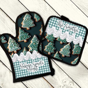 May include: A set of two green and white gingham oven mitts with a gingerbread cookie design. One mitt has the text "Baking Spirits Bright" and the other has the text "The Smiths".