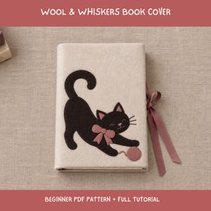 May include: A cream-colored felt book cover featuring a dark brown cat appliqué with a pink bow and a pink ball of yarn. The cover includes a pink ribbon tie on the right side. The text WOOL & WHISKERS BOOK COVER and BEGINNER PDF PATTERN + FULL TUTORIAL is visible.