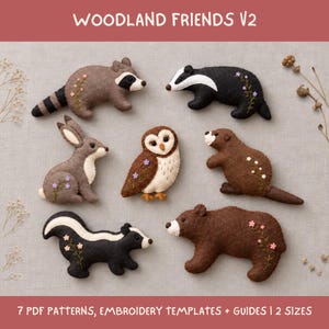 May include: A set of felt animal ornaments including a raccoon, badger, rabbit, owl, beaver, skunk, and bear. Each figure features embroidered floral accents. The text WOODLAND FRIENDS V2 and 7 PDF PATTERNS, EMBROIDERY TEMPLATES + GUIDES | 2 SIZES is visible.