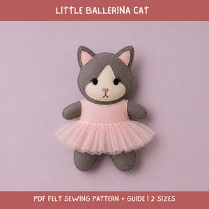 May include: A felt cat doll wearing a light pink tutu and bodice. The cat has dark gray fur, a cream-colored face, pink inner ears, and black embroidered eyes. The text LITTLE BALLERINA CAT and PDF FELT SEWING PATTERN + GUIDE | 2 SIZES is visible.