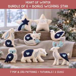 May include: A set of seven felt ornaments featuring a rabbit, fox, bird, owl, polar bear, deer, and star with the text HEART OF WINTER BUNDLE OF 6 + BONUS WISHING STAR and 7 PDF & SVG PATTERNS + TUTORIALS | 2 SIZES. The ornaments are cream, navy, and light blue.