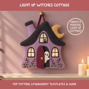 May include: A felt craft project titled LIGHT UP WITCHES COTTAGE, featuring a purple house with a black roof, a yellow crescent moon, a maroon door, and a white ghost. The text CREATE A MAGICAL LIGHT UP COTTAGE! is visible. Includes PDF pattern, embroidery templates & guide.