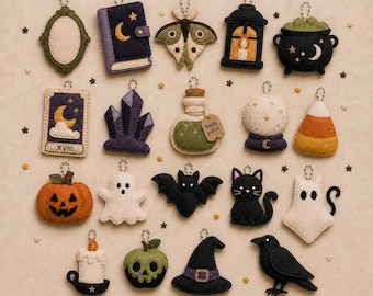 May include: A collection of nineteen felt ornaments featuring an enchanted autumn theme, including a mirror, book, moth, lantern, cauldron, tarot card, crystals, potion bottle, crystal ball, candy corn, pumpkin, ghost, bat, cat, ghost cat, candle, skull apple, witch hat, and raven.