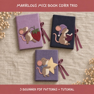 May include: Three rectangular book covers featuring felt applique mice. One light purple cover shows a mouse with a strawberry, a dark blue cover shows a mouse reading a book, and a medium purple cover shows a mouse holding a yellow star.