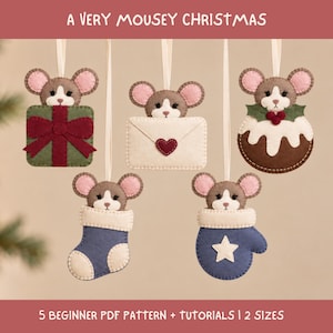 May include: Five felt mouse ornaments hanging by ribbons. Designs include a mouse with a green gift, a mouse with a cream envelope, a mouse with a Christmas pudding, a mouse in a blue stocking, and a mouse in a blue mitten. Text reads A VERY MOUSEY CHRISTMAS and 5 BEGINNER PDF PATTERN + TUTORIALS | 2 SIZES.