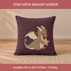 May include: A square dark purple cushion featuring an appliqué of a light olive green dragon holding a yellow star. The text STAR KEEPER DRAGON CUSHION and BEGINNER PDF & SVG PATTERN + TUTORIAL is displayed in white on the top and bottom borders.
