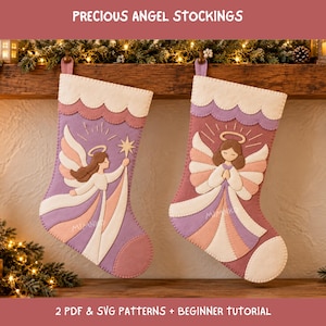 Könnte beinhalten: Zwei Weihnachtsstrümpfe aus Filz mit Engelsmotiven in Lavendel, Rosa und Creme. Der linke Strumpf zeigt einen Engel mit einem Stern, der rechte einen Engel mit gefalteten Händen. Der Text lautet PRECIOUS ANGEL STOCKINGS.