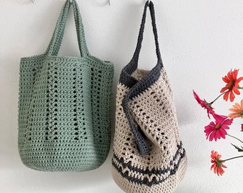 May include: Two crocheted tote bags hanging on hooks. The bag on the left is green and the bag on the right is beige with black trim.