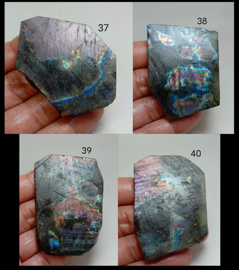 May include: Four pieces of labradorite gemstone, each with a unique shape and iridescent play of color. The stones display a range of colors, including blues, purples, and greens, with a dark gray base. Each stone is labeled with a number.