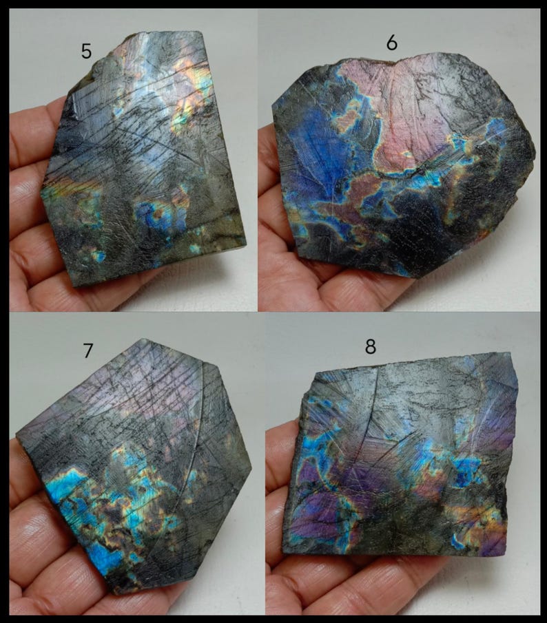 May include: Four pieces of raw labradorite gemstone, each with a unique shape and iridescent flash. The stones display a range of colors, including blues, greens, purples, and golds, set against a dark gray base. The rough texture and natural patterns are visible.