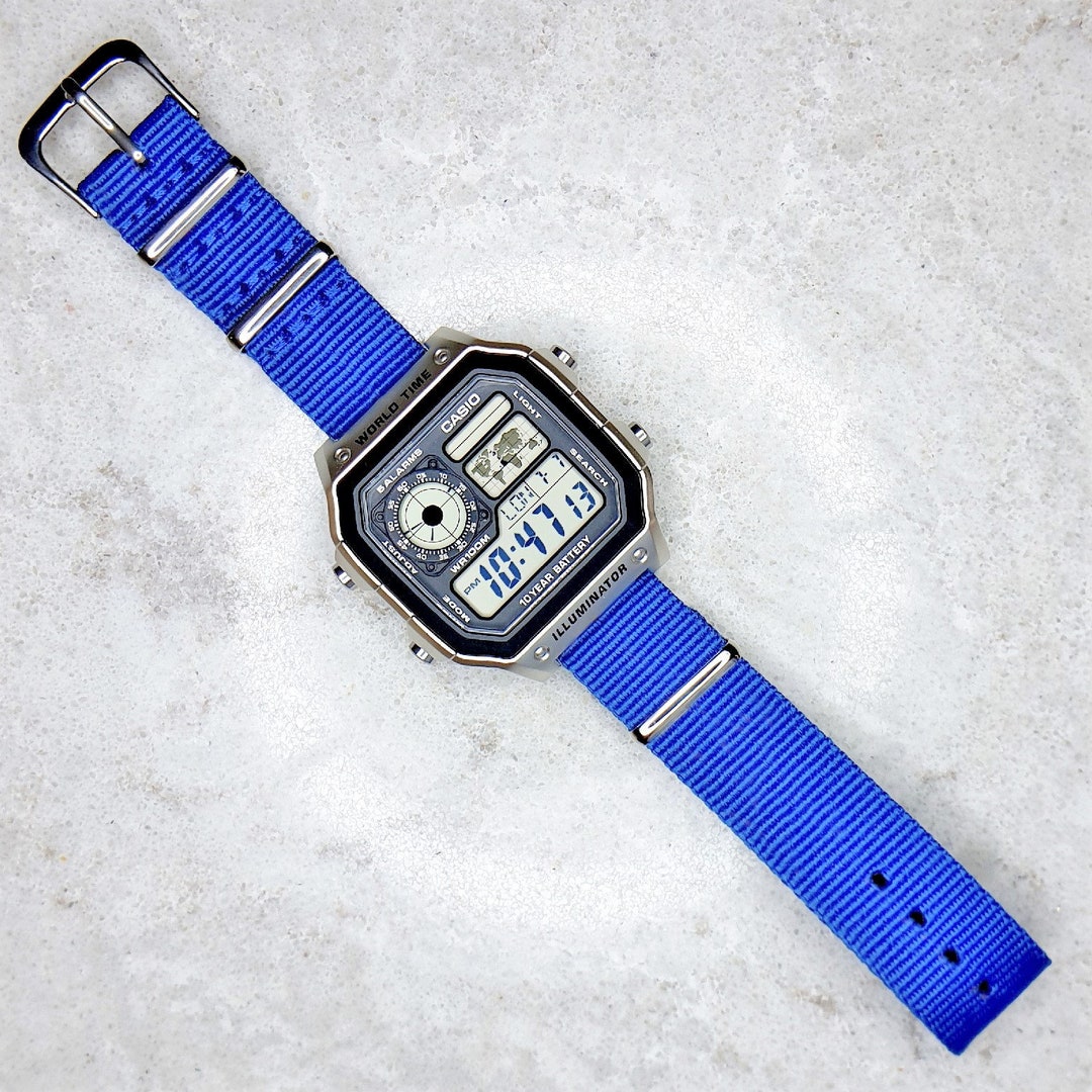 Casio World Time Illuminator Silver Watch With a Royal Blue Nylon Band ...